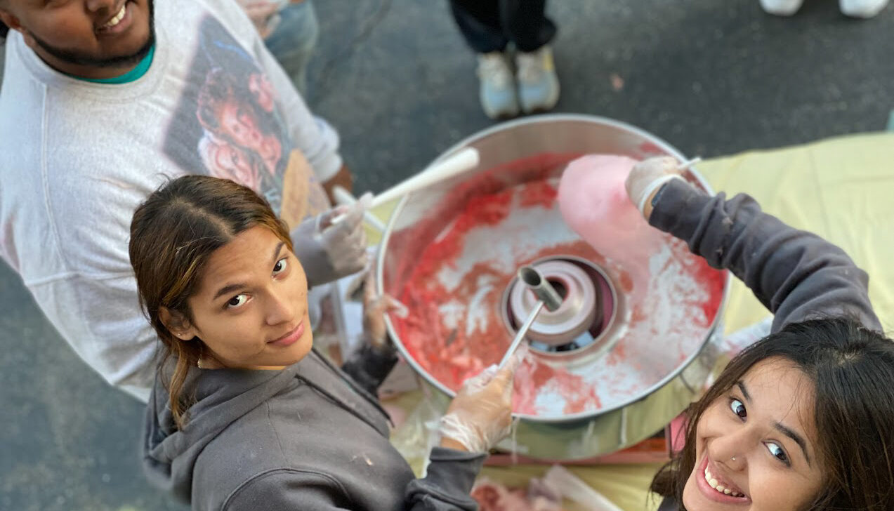 BELL Academy students standing around a large bowl of candy.